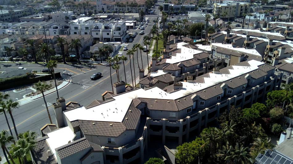 Aerial view of a GAF Everguard single-ply TPO cool roofing system installed on a multi-family building
